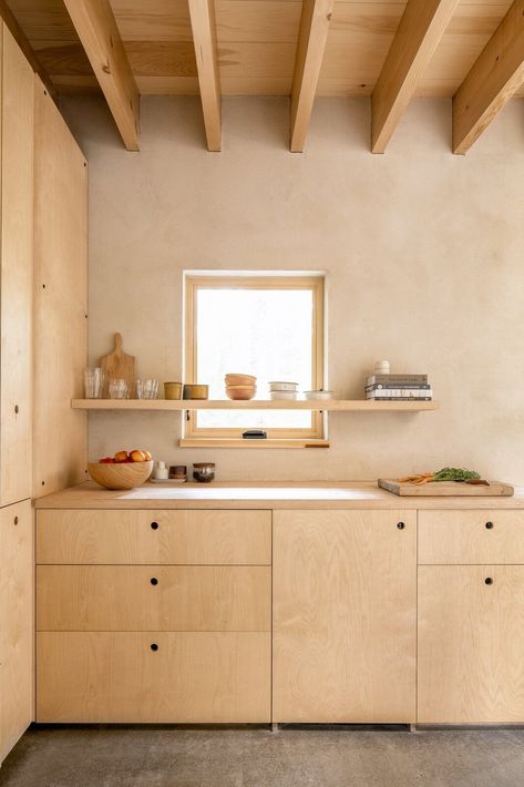 birch plywood cabinets paired with concrete floors. Different stain? Storage Room, Cabinet Storage Type, and Shelves Storage Type Streamlined birch plywood cabinetry and a maple butcher-block counter forms the kitchenette, which isn’t intended for extensive meal prep. The building is a blend of "a bedroom and camping," says Shaw, which means much of the cooking and cleaning happens outside. Birch Cabinets, Plywood Kitchen, Plywood Interior, Plywood Cabinets, Plywood Furniture, 인테리어 디자인, Birch Plywood, A Kitchen, Kitchen Inspirations