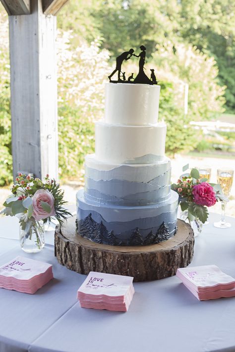 Mountain Cake Wedding, Alaska Themed Wedding, Woodsy Wedding Cake Ideas, Mountains Wedding Cake, Wedding Cake With Mountains, Nature Theme Wedding Cake, Wedding Decorations Mountain, Wedding Cake Mountain Theme, Rustic Wedding Cake Blue