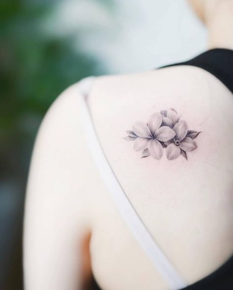 Micro-realistic plumeria tattoo done on the shoulder Plumeria Flower Tattoos, Medium Size Tattoos, Plumeria Tattoo, Community Tattoo, Tropical Tattoo, Tattoo Son, International Tattoo, Lily Flower Tattoos, Bookish Tattoos