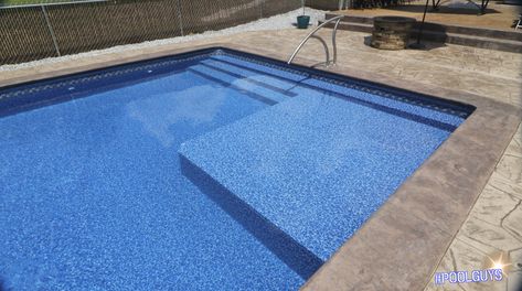 This Radiant Pool showcases a customized build; Tanning ledge with 3 steps. Concrete trim: bullnose and light Entry rail Liner Pools Inground With Tanning Ledge, Deck Space Ideas, Modern Pool Ideas, Modern Pool Deck, Radiant Pool, Pool Steps Inground, Modern Swimming Pool Designs, Modern Outdoor Living Area, Radiant Pools