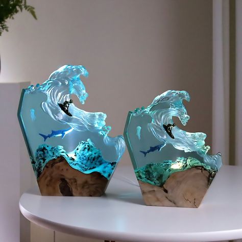 Introducing our stunning Ocean Wave LED Lamp featuring a surfer and a shark, handcrafted from epoxy resin and wood. This mesmerizing marine biology-inspired night light creates a warm, inviting glow, perfect for any bedroom, living room, or office decor. The intricate details of the shark and surfer bring the ocean to life, making it an ideal beach lover gift for him, her, dad, or any ocean enthusiast. Crafted with love and attention to detail, this unique and rustic lamp is made from high-quali Ocean Furniture, Wave Lamp, Ocean Office, Ocean Themed House, Resin Waves, Ocean Stuff, Ocean Themed Room, Aesthetic Lamps, Ocean House Decor