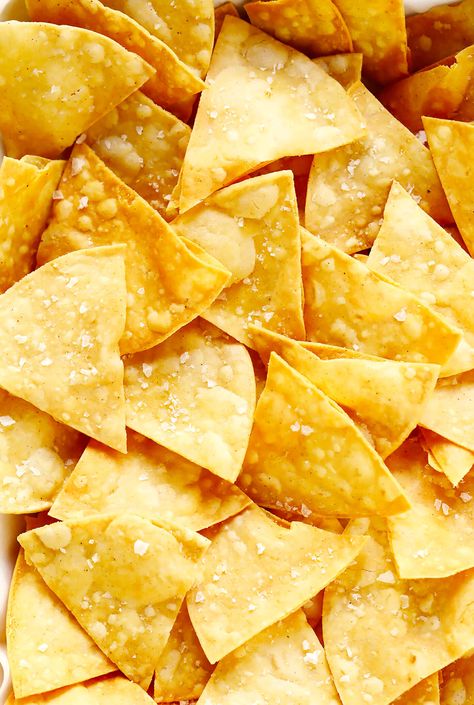 This homemade tortilla chips recipe is easy to make with 3 basic ingredients (corn tortillas, oil and salt) and always SO delicious! | gimmesomeoven.com #homemade #corn #tortilla #chips #glutenfree #vegan #vegetarian #appetizer #gameday #snack Chips From Corn Tortillas, Corn Chips Recipe, Fried Tortilla Chips, Tortilla Chip Recipe, Homemade Tortilla, How To Make Tortillas, Mexican Side Dishes, Homemade Corn Tortillas, Homemade Tortilla Chips