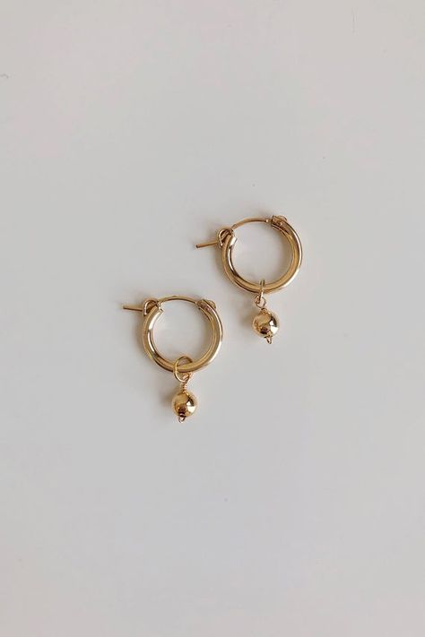 Modern, minimal and fresh! These earrings feature a mini hoop that hugs the earlobe and a 14k gold fill or sterling silver ball dangle. They are perfect for everyday, lightweight and comfortable to wear!"MINI HOOPS in Baroque Freshwater Pearl" by GoldenLinings - Christine Elizabeth JewelryD E T A I L S_________________Materials: 14K Gold Fill or Sterling SilverClosure: latch hookS I Z E S__________Measures appox. 1 1/4" in lengthM A T E R I A L S___________________With so many terms to describe Christine Elizabeth, Jewelry Affordable, Elizabeth Jewelry, Gold Dust, Mini Hoop Earrings, Gold Earrings Designs, Minimal Jewelry, Fall Jewelry, Girly Jewelry