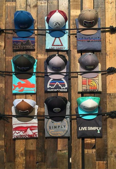 Cap Display Ideas Retail, Merchandise Ideas Clothing Retail, Hat Merchandising Ideas, Outdoor Store Display, Apparel Display Ideas, Outdoor Retail Store Design, Retail Window Design, Mens Boutique Interior Design, T Shirt Display Ideas Retail