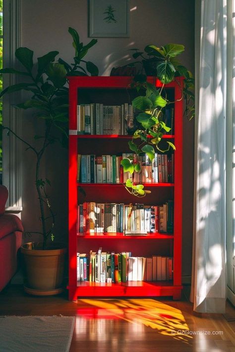 Red is such an intimidating color to work with but we’ve figured out ways to make it suit your interior design. Green And Red Room Ideas, Shelf Color Ideas Paint, Red Green Interior, Red Bookshelves, Bookshelf Refurbish Ideas, Ways To Display Books, Bookshelves Painted, Color Bookshelf, Colorful Bookshelves