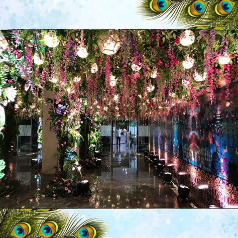 Lush Vrindavan inspired decor for a Janoi ceremony. #SamaniDecorators #weddingdecoration #weddingdecor #weddings #indianweddings #bigfatindianweddings #decor #decorideas #decoration #weddingdecor #themedecor #theme #eventplanning #eventmanagement #decorplanning #floraldecor #floralideas #floral #entrancedecor #entrance #events #function #banquetdecor #banquet Vrindavan Wedding Decor, Vrindavan Theme Wedding Decor, Vrindavan Theme Decor, Janoi Ceremony, Flower Led, Flower Garland Wedding, Wedding Decors, Peacock Theme, Hall Decor