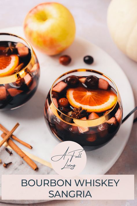 This Low Carb Fall Harvest Bourbon Whiskey Sangria is a fall treat. It combines apple cinnamon infused whiskey with red wine, apple cider and homemade sugar free keto grenadine with plenty of amazing fruit and warm fall spices to create a stunning drink! This fall harvest sangria is easy to please a crowd and whip up ahead of time for holiday festivities. #afullliving #WhiskeySangria #FallCocktails #sangriarecipes #fallsangria Sangria With Bourbon Recipes, Fall Sangria Recipes Bourbon, Whiskey Sangria Recipes, Fall Sangria With Bourbon, Cinnamon Whiskey Sangria, Whiskey Sangria, Bourbon Sangria, Harvest Sangria, Spiced Wine Recipe