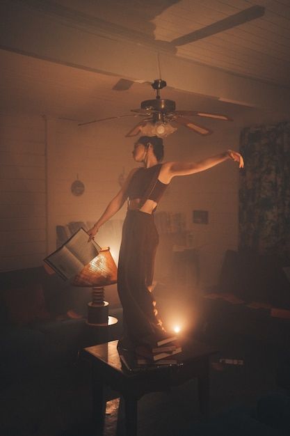 Woman At Desk Aesthetic, Person Sitting With Legs Dangling, Someone Holding A Book, Poses Holding Something, Young Woman Aesthetic, Person Holding Book, Dancing On Table, Woman Holding Book, Book Woman