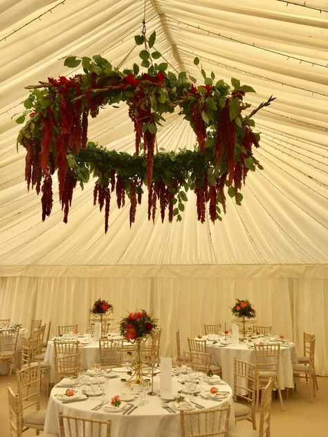 Hanging flowers at this Indian wedding at Sezincote in The Cotswolds. These hanging hoops look amazing in marquee weddings. This one features trailing red amaranthus. Hanging Flowers Wedding Arch, Wedding Hanging Wreath, Hanging Florals Wedding, Red Wisteria Wedding, Red Wisteria, Wedding Hanging Flowers, Amaranthus Wedding, Red Hanging Flowers, Hanging Amaranthus Wedding