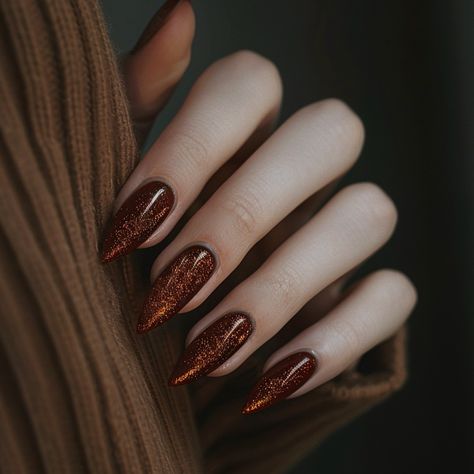 Deep, rich, and dazzling, this nail look captures the warmth of autumn with a stunning burnt copper hue. The almond-shaped nails are coated in a glossy, glitter-infused polish that shimmers with every movement, exuding a subtle elegance perfect for the cooler seasons. This design brings a touch of glamour to the cozy, earthy tones of fall, making it a must-try for those looking to embrace the season in style. Aligning perfectly with the current trend of metallic and glitter finishes, this lo... Copper Nails Designs, Copper Nails, Shaped Nails, Subtle Elegance, Almond Shaped, Earthy Tones, Almond, Nail Designs, Copper