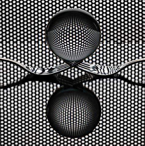 Experimenting with forks and my sphere, plus grid. lighting from underneath and behind.. great patterns emerge in the refraction of the light in the sphere. simply moving an inch up or down changes the detail seen in the sphere.. Commended in Sony World Photo Awards Symmetry Photography, Cutlery Art, Photography Ideas At Home, Glass Photography, Shadow Photography, Creative Photography Techniques, Still Life Photos, Foto Tips, Diy Photography