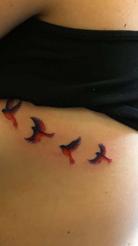 Birds flying into the sunset ribcage tattoo Cardinals Flying Tattoo, Bird Tattoo Ribcage, Cardinal Flying Tattoo, Flying Cardinal Tattoo, Cardinals Tattoo, Winter Tattoos, Red Bird Tattoo, Cardinal Bird Tattoos, Small Cardinal Tattoo