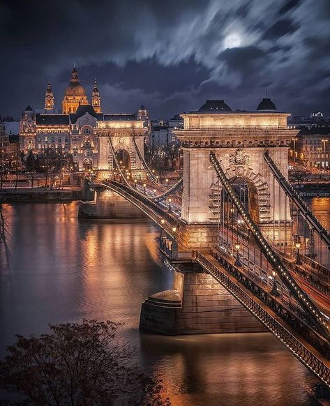 The Széchenyi Chain Bridge is a chain bridge that spans the River Danube between Buda and Pest, the western and eastern sides of Budapest, the capital of Hungary. Designed by English engineer William Tierney Clark and built by Scottish engineer Adam Clark, it was the first permanent bridge across the Danube in Hungary. It was opened in 1849. 🇭🇺 Budapest Instagram Story, Gresham Palace, Capital Of Hungary, Best Places In Europe, Budapest Travel, Europe Photos, Voyage Europe, Places In Europe, Visiting Greece