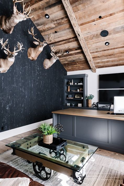 Black walls, a rustic wood ceiling and mounted taxidermy give the husband’s office a decidedly masculine vibe. Photography: Rebekah Westover Deisgn: Remedy Design Firm, Joe Carrick Chic Modern Farmhouse Living Room, Rustic Masculine Decor, Masculine Home Office Ideas Rustic, Office With Deer Mounts, Modern Trophy Room, Lodge Style Office, Man Cave Office Ideas Rustic, Mans Office Ideas, Black Walls Wood Ceiling