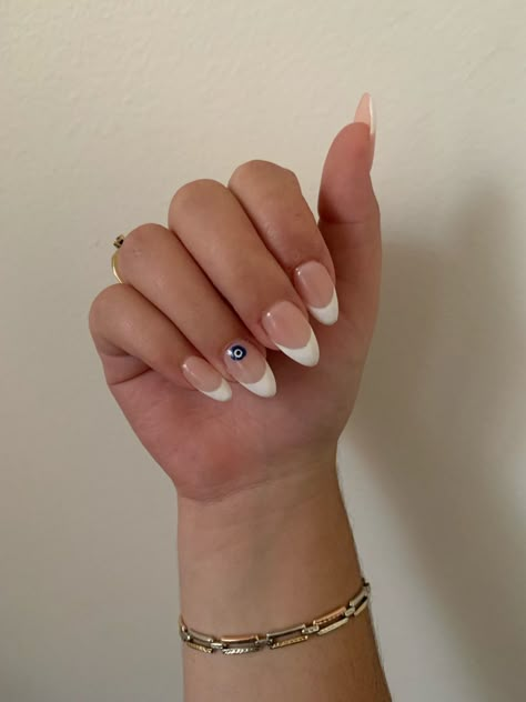 Amond shaped evil eye french tip nails <3 Small Evil Eye Nails, French And Evil Eye Nails, Summer Nails Blue Evil Eye, Evil Eye Nails With French Tip, White French Tip Nails With Evil Eye, French Tip With Evil Eye Nails, French Nails With Evil Eye Design, Nail Inspo Almond Evil Eye, Almond Nails French Tip Evil Eye