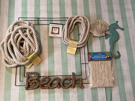 how to make a dollar tree coastal wreath Coastal Wreaths Front Doors Diy, Diy Nautical Wreath, Nautical Wreath Diy, Coastal Wreaths Beach Themes, Nautical Rope Wreath Diy, Beach Wreath Ideas Diy, Coastal Door Wreath, Nautical Rope Decor Diy, Diy Metal Wreath