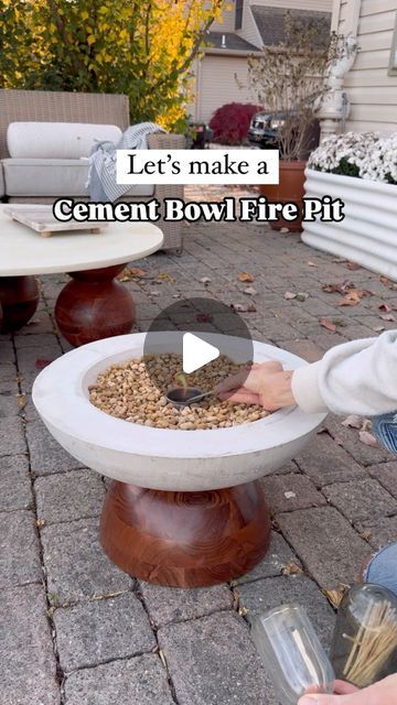 Abby Kulp  DIY | DESIGN on Instagram: "DIY Cement Fire Pit 🤩 The weather is getting chilly but November calls for cozy outdoor movie nights!! I made this large cement fire pit bowl and it added the perfect touch of coziness. 🧡  What you will need: • Large and small metal mixing bowls. (Found mine at a restaurant supply store - spent $30) • Bag of cement (Home Depot) • Canola Oil • Sander or hammer to tap/vibrate out air bubbles • Small metal cup (Found mine at Five Below) • Rubbing Alcohol  • Small stones (Home Depot)  Follow along for more DIY inspo and funnnnnnn 🫶  #patiodecor #movienight #firepit #diyprojects #outdoorfurniture #familytime #november" Fire Bowls Outdoor Diy, Diy Table Top Fire Bowl, Cement Fire Pit, Fire Pits Diy, Metal Mixing, Cement Home, Bag Of Cement, Indoor Fire Pit, Cement Table