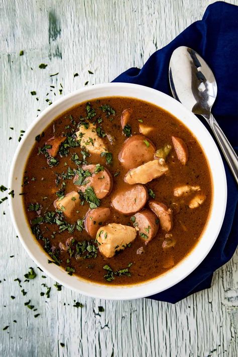 This comforting Creole chicken and sausage gumbo is made with a rich and dark roux, loaded with chicken, smoked andouille, tomatoes, and plenty of spices. Creole Chicken And Sausage, Creole Gumbo Recipe, Chicken And Sausage Gumbo Recipe, Sausage Gumbo Recipe, Soup Bisque, Soups Slow Cooker, Rosemary Steak, Creole Chicken, Dark Roux