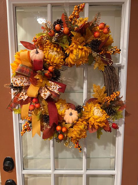 Fall Grapevine Wreath featuring Gold Mums, Light Orange Pumpkins, Berries, Pine Cones and Colorful Leaves with a multi layered Bow. Fall Grapevine Wreath, Layered Bow, Fall Mums, Fall Grapevine Wreaths, Wreath Crafts, Colorful Leaves, Pumpkin Orange, Door Wreath Hanger, Light Orange