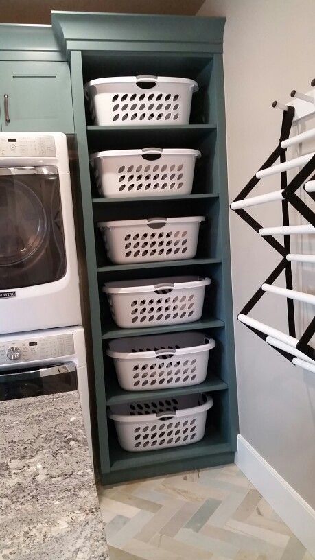 SLC Parade of Homes 2015: This is a NEED for my laundry. No "want" about it! A basket for each kid (including husband). Diy Lavanderia, Diy Laundry Room Storage, Laundry Room Organization Storage, Laundry Room Storage Shelves, Laundry Room/mud Room, Room Storage Diy, Basement Laundry, Farmhouse Laundry Room, Laundry Room Remodel