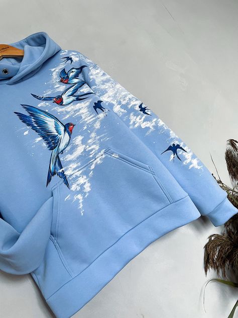 High quality hoodie with swallows.  Swallows are a symbol of spring, lightness, rebirth, goodness and happiness.  The drawing is applied by hand with brushes and special paints. Therefore, each product is not 100% similar to the previous one and is unique. ✨Material: ✅Premium quality knitwear (95% cotton, 5% elastane) ✅Soft and comfortable to wear ✅Colorfast and resistant to deformation ✅Unisex (suitable for both men and women) HOW TO ORDER 1. Select 𝗦𝗶𝘇𝗲. 3. Choose the desired color of the hoodie 4. Click 𝗔𝗗𝗗 𝗧𝗢 𝗖𝗔𝗥𝗧. 🚨Custom-made designs may differ slightly from the original in the photo. Because each product is hand-painted and unique.🚨 📏Size Guide: Refer to the size chart in the photos For the most accurate fit, measure your own hoodie and compare to the chart We will c Painting On Hoodies, Drawing On Hoodie, Unique Hoodies Design, Cool Hoodies Designs Unique, Hoodie Print Design Ideas, Hoodie Painting Ideas, Hand Painted Hoodie, Cool Hoodies Designs, Hand Painted Clothes