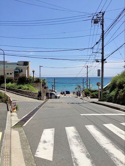 This is an image of a road with cars and people on it. The road is located near a body of water. Japan Tokyo Aesthetic, Japan Countryside, Tree Building, Tokyo Aesthetic, Japanese Countryside, Japan Street, Sky Tree, Landscape View, Japanese Landscape