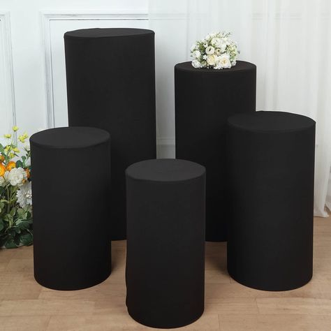 PRICES MAY VARY. Quantity: Set of 5 Display Stands Covers Material: Spandex Color: Black Cover Sizes: S: 19.5"H x 11"W M: 21.5"H x 12"W L: 23.5"H x 12.5"W XL: 29.5"H x 14"W XXL: 35.5"H x 16"W Thickness: 160 GSM Use it with our Set of 5 Acrylic Cylinder Plinth Display Box Stands Features: Lightweight, pullover cover to get a snug fit, easy to slip on and take off PREMIUM QUALITY: These Display Box Stand Covers are made from a high-quality spandex material with shiny glittered. This elegantly shim All Black Party, Bday Dinner, Mall Stores, 50th Bday, Pedestal Stand, Acrylic Display Stands, Up Theme, Home Decor Sets, Display Stands