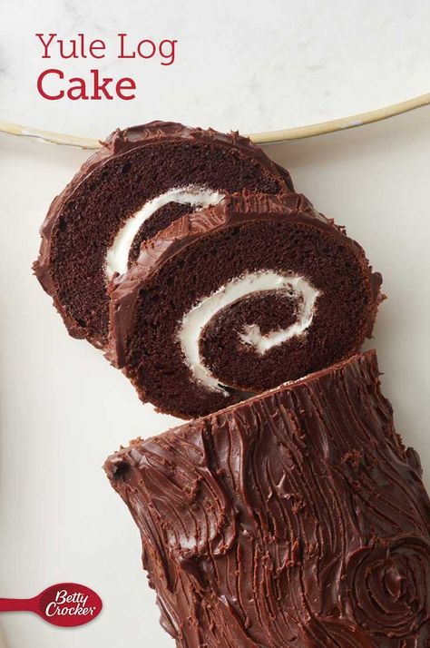 Also known as bûche de Noël, this chocolate roll cake is both a stunning holiday centerpiece and an impressive finish to any winter gathering. Made with Betty Crocker™ cake mix and whipped frosting, this log cake recipe is a baking project that will be a highlight of your holiday cooking this year. Expert tip: For a garnish, brush cranberries with water and roll in coarse white or gold sugar. Add fresh mint leaves. Log Cake Recipe, Easy Yule Log Recipe, Rolled Cake, Yule Log Cake Recipe, Yule Log Recipe, Betty Crocker Cake Mix, Christmas Yule Log, Chocolate Yule Log, Recipes Using Cake Mix