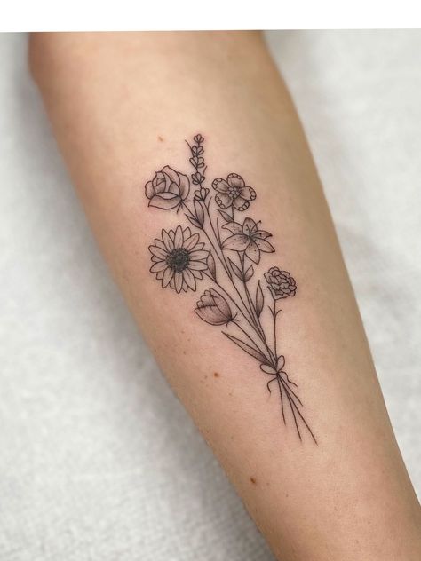 Five Flower Bouquet Tattoo, Black And White Birth Flower Tattoo, Sunflower And Rose Bouquet Tattoo, Bouquet With Ribbon Tattoo, Small Floral Forearm Tattoo Women, Five Flowers Tattoo, Flower Arrangements Tattoo, 7 Flower Bouquet Tattoo, Mixed Flower Bouquet Tattoo