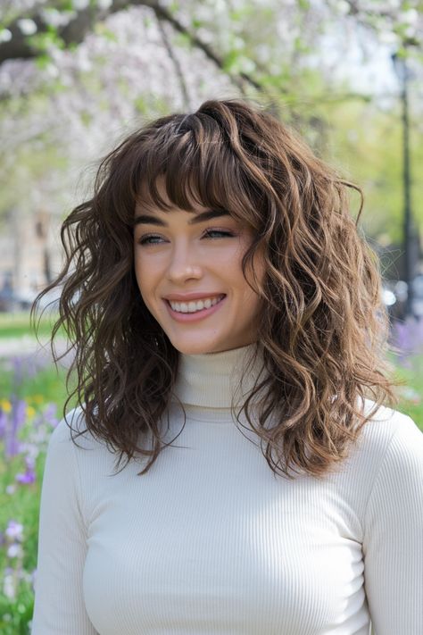 Embrace the charm of curly hairstyles paired with stylish curtain bangs! This look is perfect for medium to long hair, framing your face beautifully while enhancing your natural curls. Whether you wear it down in loose waves or half up for a playful vibe, this hairstyle is a summer favorite that’s easy to achieve. Perfect for any occasion, you'll definitely turn heads! #curlyhairstyles Loose Waves With Bangs, Curly Hairstyles With Curtain Bangs, Curly Curtain Bangs, Curly Hair Curtain Bangs, Hair Framing, Hairstyles With Curtain Bangs, Medium Curly Haircuts, Medium To Long Hair, Medium Curly