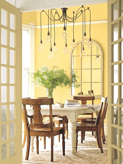 17 Yellow Dining Room Designs Ideas To Try | Interior God Pale Yellow Paints, Yellow Kitchen Walls, Harvest Dining Table, Yellow Dining Room, Light Bulb Design, Yellow Paint Colors, Yellow Paint, Benjamin Moore Colors, Hunter Douglas