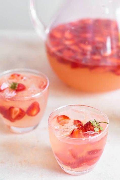 Bring sunny vibes straight to your couch. READ MORE... Spiked Strawberry Lemonade, Summer Fruit Cocktails, Recipes With Fruit Cocktail, Easter Drink, Homemade Strawberry Lemonade, Pitcher Drinks, Strawberry Lemonade Recipe, Pitcher Cocktails, Lemonade Punch