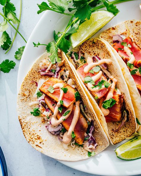 These ahi tuna tacos are bursting with flavor! They pair seared ahi tuna with cilantro lime slaw and creamy chipotle sauce. #tunatacos #ahitunatacos #ahituna #tunasteak #tunataco #tacos #tacorecipe Tuna Tacos Recipe, Ahi Tuna Tacos, Fish Taco Recipe, Seared Ahi Tuna, Tuna Tacos, Ahi Tuna Steak, Lime Slaw, Frozen Steak, Cilantro Lime Slaw