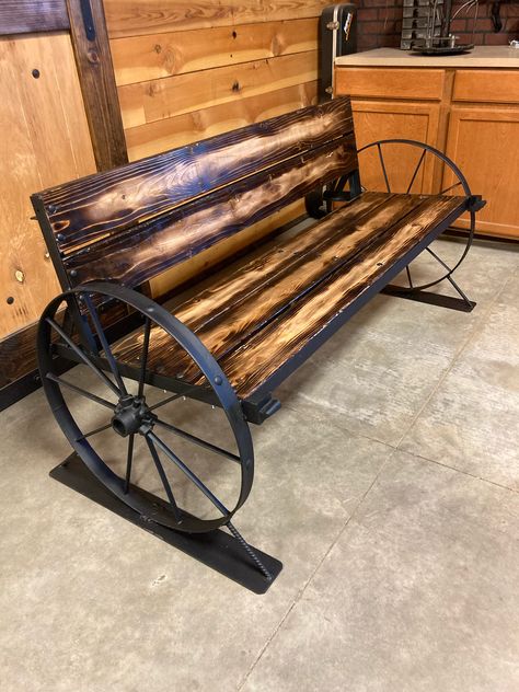 Welding Bench Ideas, Metal Wheel Ideas, Metal Wagon Wheel Decor Outdoor, Bachelor Flat, Wagon Wheel Bench, Welding Bench, Wagon Wheel Decor, Metal Wagon, Wrought Iron Bench