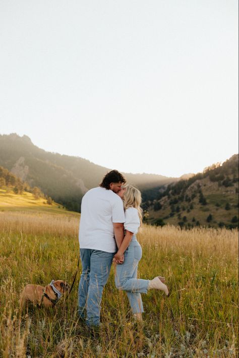 Looking for a pet-friendly engagement session location in Colorado? Chautauqua Park in Boulder, CO may be the perfect spot for your engagement photos! The park has a trail leading into a meadow with a beautiful view of the flat irons and dogs are allowed as long as they are leashed! If you’re looking for a wedding photographer, inquire on my website and let’s chat! Long Distance Engagement Photos, Fall Engagement Pictures With Dog, Engagement Photos With Dogs, Meadow Engagement Photos, Pasture Couple Pictures, Fall Couple Photos With Small Dog, Meadow Couple Photoshoot, Boulder Engagement Photos, Western Engagement Photos