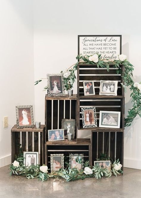 When a client contacts us with a unique idea for their big day, we are happy to bring it to life! Elyse & Josh's wedding featured our wooden crates filled with photographs among some of our most gorgeous faux flowers—a perfect display! #illumepghdesign #burghbrides #weddingdesign #eventdecorator #weddingdecorator #weddingday #weddingdecorations #weddingplanning #weddinginspiration #weddingdetails #instawedding #generationsoflove #photodisplay #woodencrates #fauxfloral #whitebarnwedding Wooden Crate Ideas Wedding, Wedding Memory Wall, Crate Wedding Decor, Wooden Crates Wedding, Wood Crate Shelves, Photo Display Ideas, Wedding Crates, Anniversary 50th, Wedding August