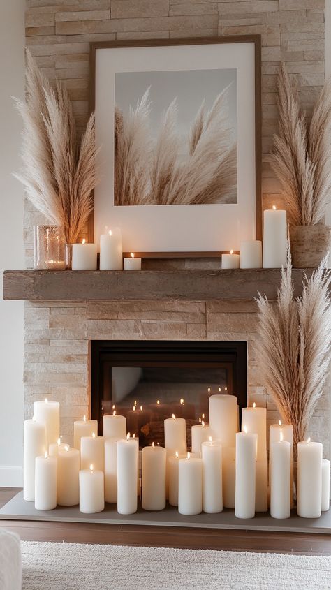 Elegant winter fireplace with white candles, pampas grass, and neutral tones, creating a cozy holiday atmosphere. Fireplace Hanging Decor, Decorate Mantel Ideas, Everyday Mantle Decorating Ideas With Tv, Joanna Gaines Mantle Decor, Mantle Piece Decor, Boho Fireplace Decor, Everyday Mantel Decorating Ideas, Cozy Christmas Mantle, Boho Mantle Decor