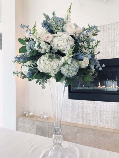 Blue and white at Belle Mer Slate Blue Flower Arrangements, Light Blue Themed Wedding, Tall Centerpiece Ideas, Blue And White Wedding Theme, Blue And White Wedding Flowers, Blue Flower Centerpieces, Blue Hydrangea Centerpieces, Centerpieces Blue, Hydrangea Centerpieces