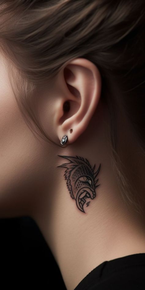 A mesmerizing under-ear dragon tattoo, highlighting an expertly designed pattern with refined shading and flowing lines in a subtle yet powerful design, encapsulating the essence of courage and wisdom. This dramatic tattoo allows for a stylish yet meaningful expression of personal emotions, spiritual connection, and individual fashion in a hidden spot. Dragon Tattoo Ideas, Spiritual Evolution, Latest Tattoos, Cute Tattoos For Women, Face Tattoos, Tattoo Trends, Dragon Tattoo, Inner Strength, Geometric Art