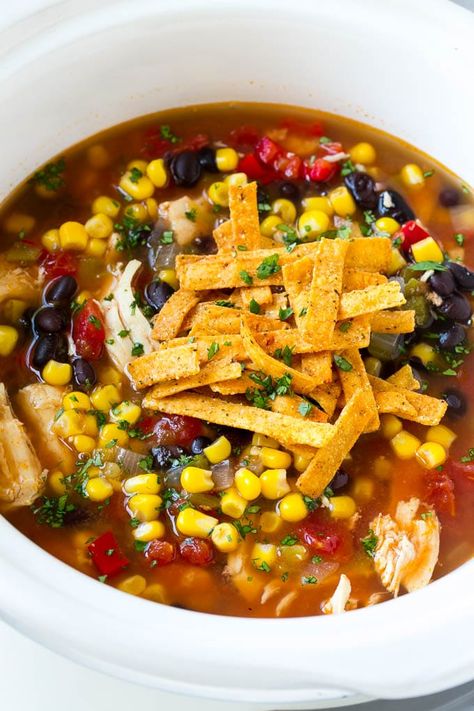 A slow cooker of chicken tortilla soup topped with tortilla strips. Slow Cooker Chicken Tortilla Soup Recipe, Crock Pot Dinners, Chicken Soup Crockpot, Slow Cooker Chicken Tortilla Soup, Tortilla Strips, Chicken Tortillas Soups Recipe, Slow Cooker Pasta, Pot Dinners, Hot And Sour Soup