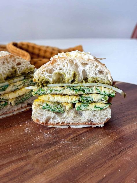 Experience the ultimate morning delight with my Egg, Pesto, & Cheese Breakfast Sandwich! This Starbucks copycat recipe is bound to become your new favorite breakfast treat. My version is a perfect blend of simplicity and deliciousness. The creamy basil pesto, melted Swiss cheese, and perfectly cooked egg patty make for an unbeatable combination that’s not only scrumptious but also a great source of protein to kickstart your day. Egg Patty, Pesto Eggs, Egg Sandwich Recipe, Egg Sandwich Breakfast, Pesto Sandwich, Pesto Cheese, Cheese Breakfast, Starbucks Copycat, Basil Pesto