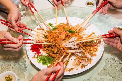 A group of people mixing and tossing Yee Sang dish with chop sticks. Yee Sang is , #Ad, #Sang, #Yee, #chop, #dish, #people #ad Yee Sang, Yu Sheng, Pomelo Salad, Whole Wheat Crackers, Green Capsicum, Wheat Crackers, Plum Sauce, Toast In The Oven, Five Spice Powder