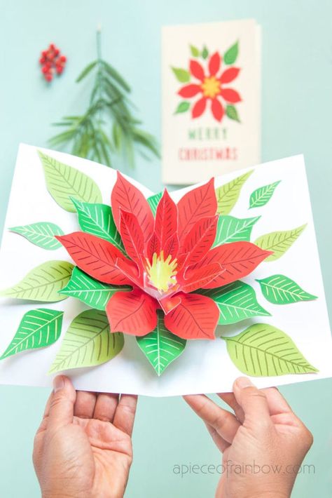 Make an unique DIY pop up Christmas card with a beautiful Poinsettia flower design! Fun & easy Christmas paper craft with free printable templates! – A Piece of Rainbow #diy #crafts #crafting #papercraft #papercrafts #craftsforkids crafts for kids and family, #greetingcard #flower #anthropologie #poinsettia #cardmaking #gift Rainbow Diy Crafts, Free Printable Christmas Cards, Pop Up Christmas Cards, Christmas Paper Craft, Diy Pop Up Cards, Pop Up Card Templates, Free Printable Templates, Diy Pop, Rainbow Diy