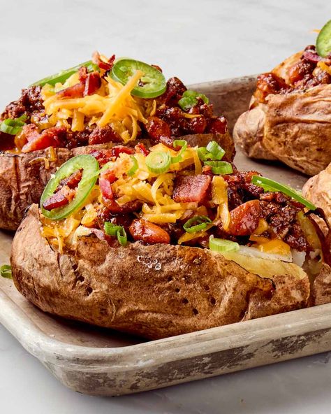 angled shot of cowboy baked potatoes on a sheet pan topped with chives Ground Meat Dinners, Ground Beef Beans, Potato Baked, Best Baked Potato, One Pot Cooking, Stuffed Potatoes, Stuffed Baked Potatoes, Baked Potato Recipes, Meat Dinners