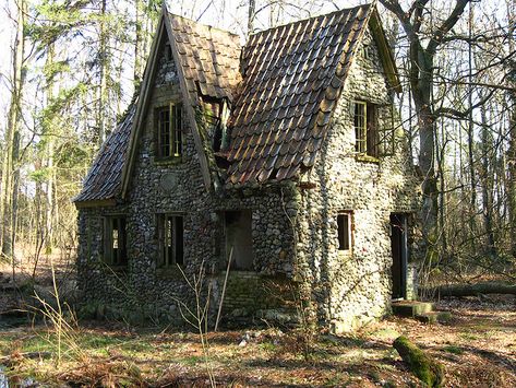 "Stone house in the forest of Denmark: When the Germans were in Denmark in World War II, they took over a man's farm. This man moved into the deep forest and made this house of stone. Around the house is a moat." Mansion Homes, Stone Cottages, Old Abandoned Houses, Abandoned House, This Old House, Cottage In The Woods, Abandoned Mansions, Stone Cottage, Cabins And Cottages