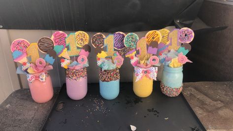 Donut Theme Centerpiece Ideas, Sweet Theme Centerpieces, Donut Party Table Centerpiece, Donut Grow Up Party Centerpieces, Donut Theme Centerpieces, Donut Party Centerpieces Diy, Sweets Centerpiece Ideas, Two Sweet Birthday Party Centerpiece, Donut Table Centerpiece