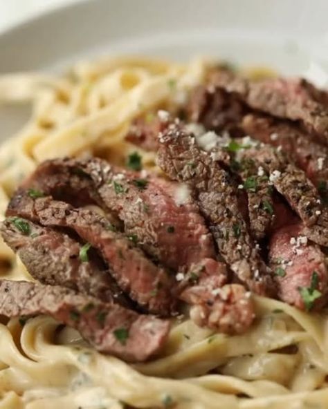 Daily Recipes on Instagram: "Say "YUM" if you would eat this STEAK PASTA by @dontgobaconmyheart_

Serves 2

INGREDIENTS

1x 285g/10z Ribeye Steak or steak of choice, at room temp*
1 tbsp Veg Oil
1 heaped tbsp Unsalted Butter
200g / 7oz Tagliatelle, or other long-cut pasta
2 small Shallots, finely diced
120ml / 1/2 cup zero salt Chicken Stock
1x 150g/5.3oz block of Garlic & Herb Boursin Cheese, leave at room temp
20g / 1/4 cup freshly grated Parmesan, plus more to serve if desired
1 tbsp finely diced Fresh Parsley, plus more to serve if desired
Salt & Black Pepper

METHOD

1️⃣Pat the steak dry then generously season both sides with salt & pepper. Place a large cast-iron or heavy-based pan over high heat. Once the pan is piping hot add the oil and leave for 5-10 secs. Add the steak & cook fo Steak And Noodle Recipes, Steak Alfredo Pasta Recipes, Steak With Noodles, Steak And Pasta Recipes, Steak Pasta Recipes, Pasta With Steak, Steak And Pasta, Roast Dinner Sides, Pasta Beef