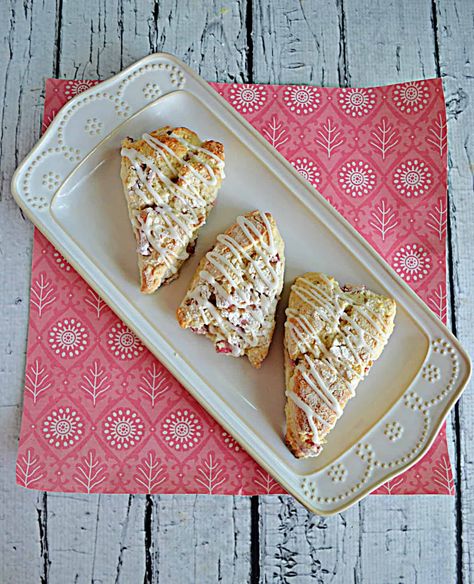 Sweet and buttery rhubarb scones studded with pieces of fresh rhubarb and topped off with coarse sugar make for a delicious afternoon snack. #rhubarb #scones #easyrecipes Rhubarb Recipes Easy, Tunnel Of Fudge Cake, Rhubarb Scones, Ice Cream Muffins, Fudge Cake Recipe, Fresh Rhubarb, Orange Scones, Cream Scones, Rhubarb Recipes