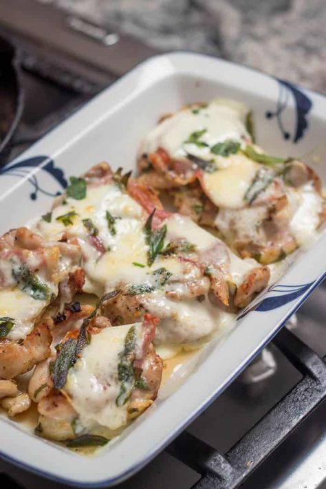 Chicken Saltimbocca is sautéd chicken topped with prosciutto, melted fontina cheese, and crispy fried sage leaves. Saltimbocca means "it jumps in your mouth" and that's how much flavor this dish packs! It's elegant enough for company, and easy enough for a weeknight. #saltimbocca #chickensaltimbocca #Italian #Italianretr Fontina Cheese Recipes, Chicken Saltimbocca Recipe, Best Roast Chicken Recipe, Chicken With Prosciutto, Veal Saltimbocca, Fried Sage, Prosciutto Recipes, Chicken Saltimbocca, Crispy Chicken Thighs