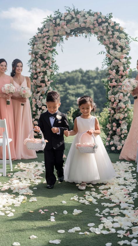 Vibrant outdoor wedding setup with a floral arch and children with petal baskets, emphasizing spring colors. Outdoor Spring Wedding Ideas, Wedding Outline, Color Palette For Spring, Spring Wedding Aesthetic, Wedding Aesthetic Ideas, Greenery Runner, Summer Wedding Venues, Colorful Spring Wedding, Outdoor Spring Wedding